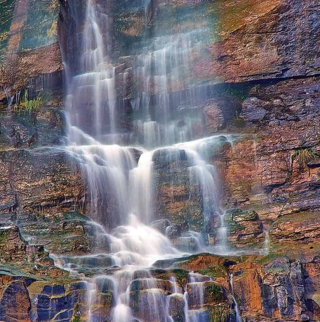 Lower Cascade Falls is visible from almost everywhere in Ouray, Colorado as it plummets several hundred feet down a steep rock face above 8th Street. This is a close-up image of the lower section of the falls just before it reaches the ground.