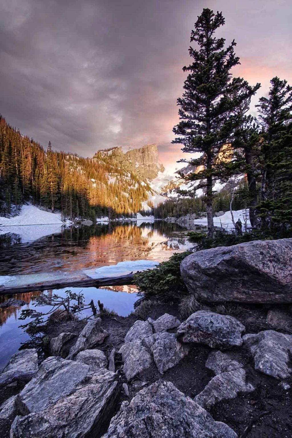 Dramatic dawn light falling over Dream Lake and Hallett Peak in Rocky Mountain National Park, Colorado.