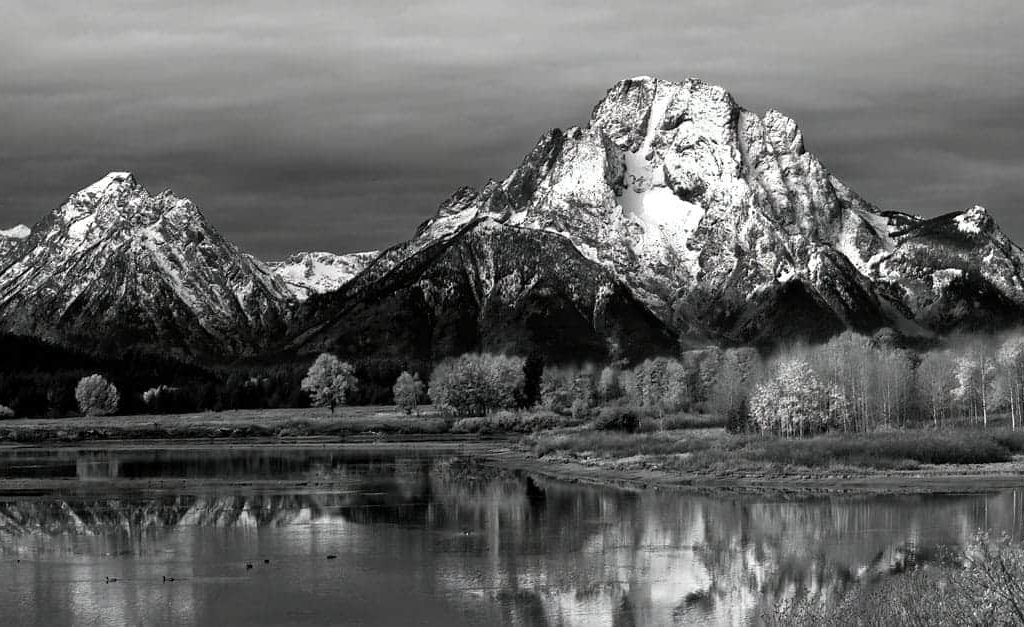 Black and white version of Mt. Moran and the fall colors along the Snake River at Oxbow Bend in Grand Teton National Park, Wyoming on an overcast afternoon.
