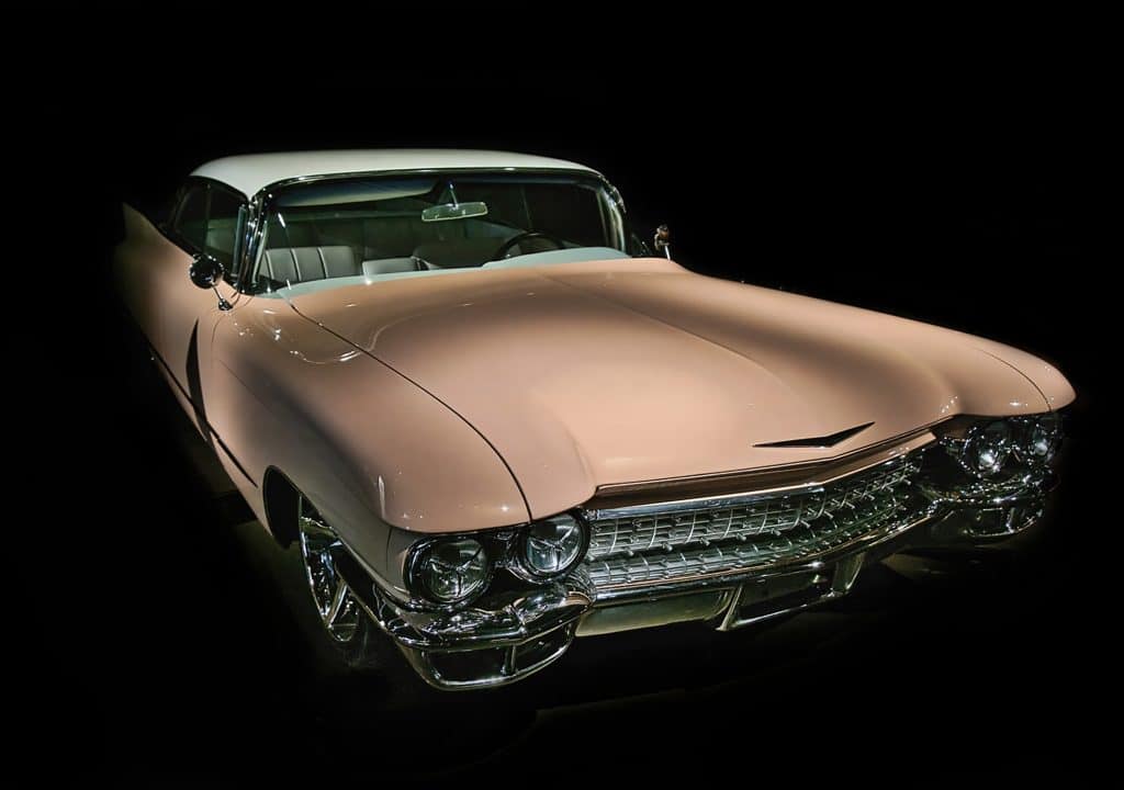 A well-restored, classic, late 1950's pink Cadillac coupe.