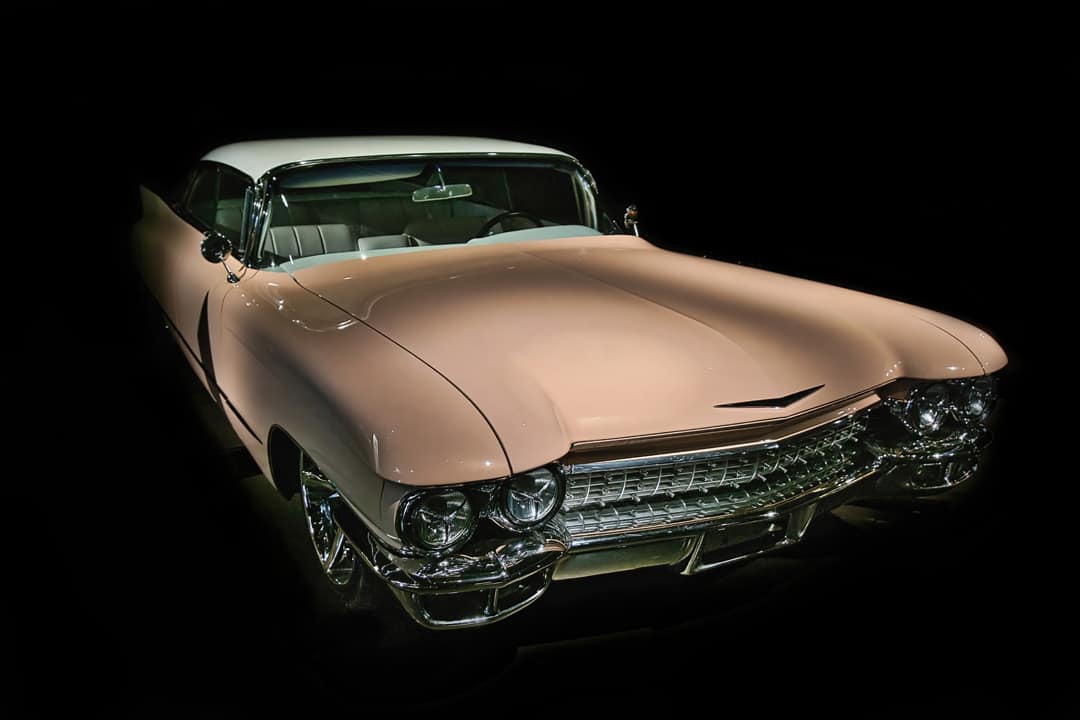 A well-restored, classic, late 1950's pink Cadillac coupe.