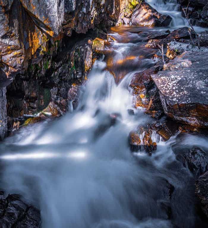 Missouri Creek cascades down a series of small wateralls in a steep gorge within the Holy Cross Wilderness Area of Colorado.