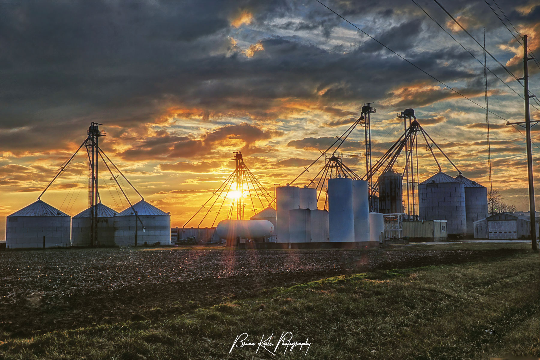 Dramatic winter sunset over the grain bins and silos near the tiny central Illinois town of Milmine.