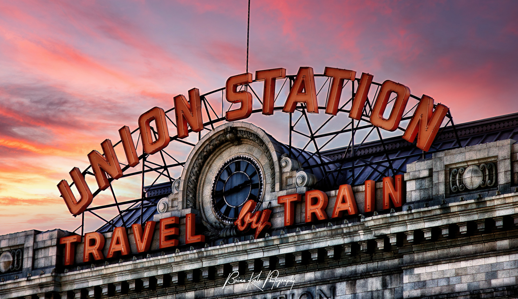 Close-up of the iconic Union Station sign in lower downtown Denver, Colorado at sunset.