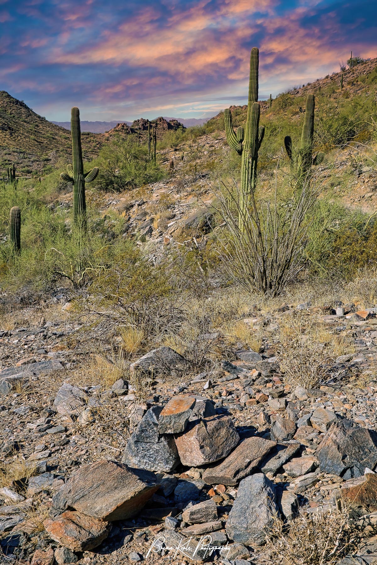 A colorful sunrise sky over the rocky and mountainous Sonoran desert landscape outside of Phoenix, Arizona.