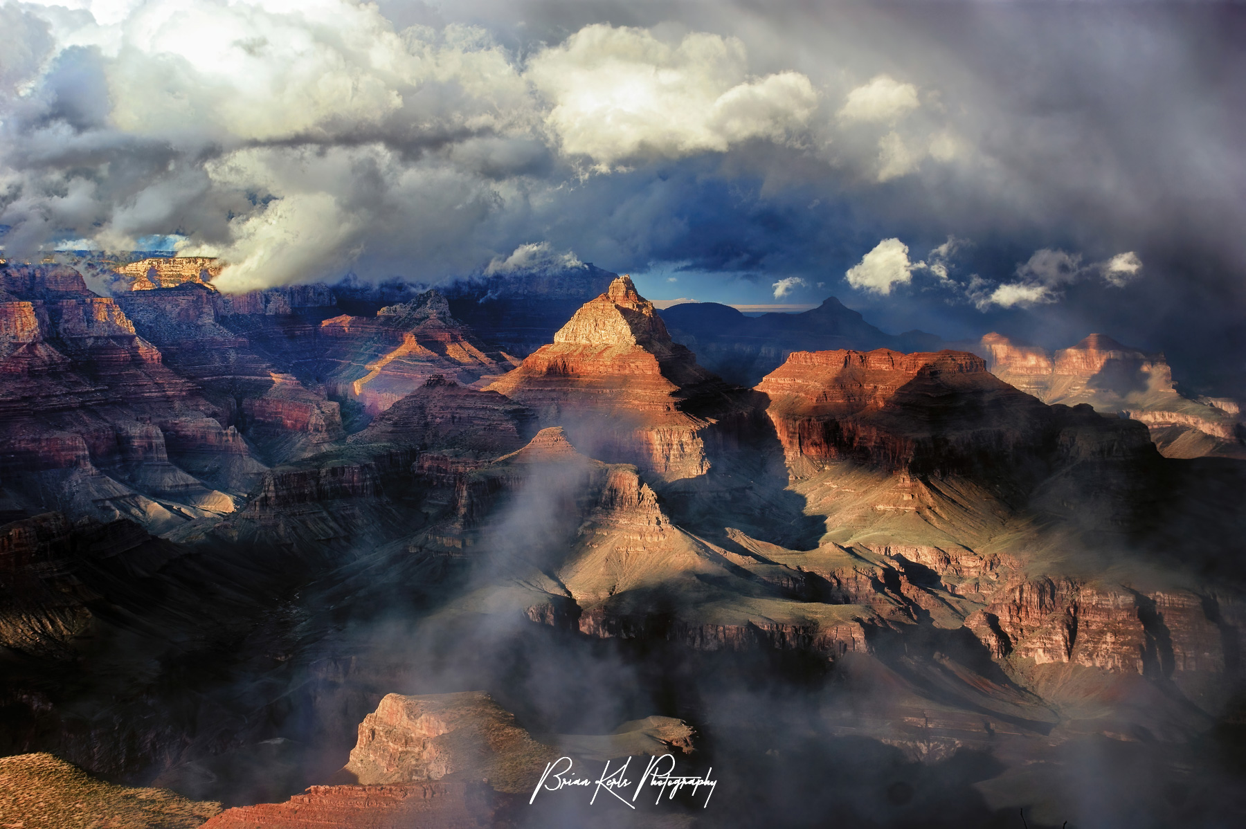 Driving through Grand Canyon National Park on a November afternoon I encountered an unexpected storm that dropped heavy rain, hail, and at the higher elevations, snow. Not having a lot of time in the park that day I was worried that the weather would prevent me from getting any shots. I was able to wait out the storm for a bit and during a brief clearing capture the Grand Canyon and surrounding storm clouds illuminated in the late afternoon light.