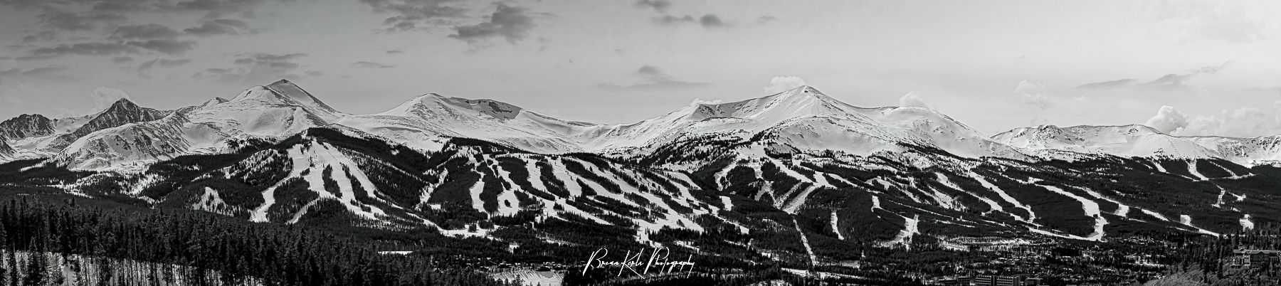 A late winter, multi-image panorama of the snow-capped peaks of Breckenridge Ski Resort in Summit County, Colorado.