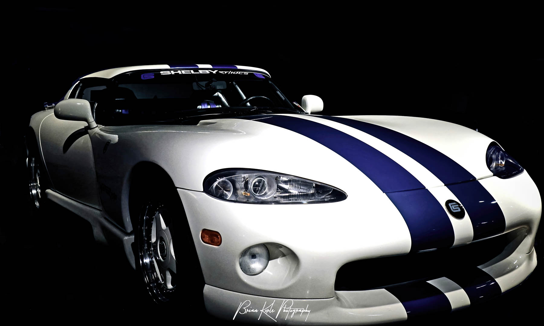 A rare Wimbledon White and Guardian Blue Carroll Shelby limited edition Dodge Viper RT/10. One of only 19 made, this Viper has an aluminum alloy 8 liter, V10 engine redesigned by Lamborghini which produces over 400hp with a 0-60mph time of 4 seconds.