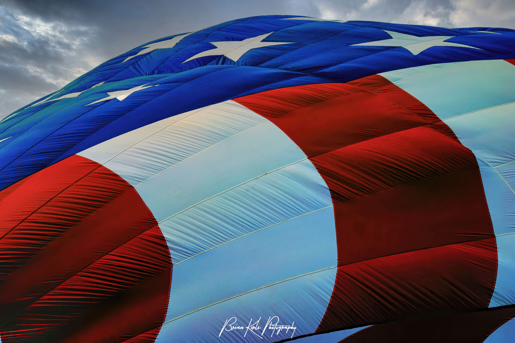 Patriotic hot air balloon being inflated at the Colorado Springs Hot Air Balloon Festival.