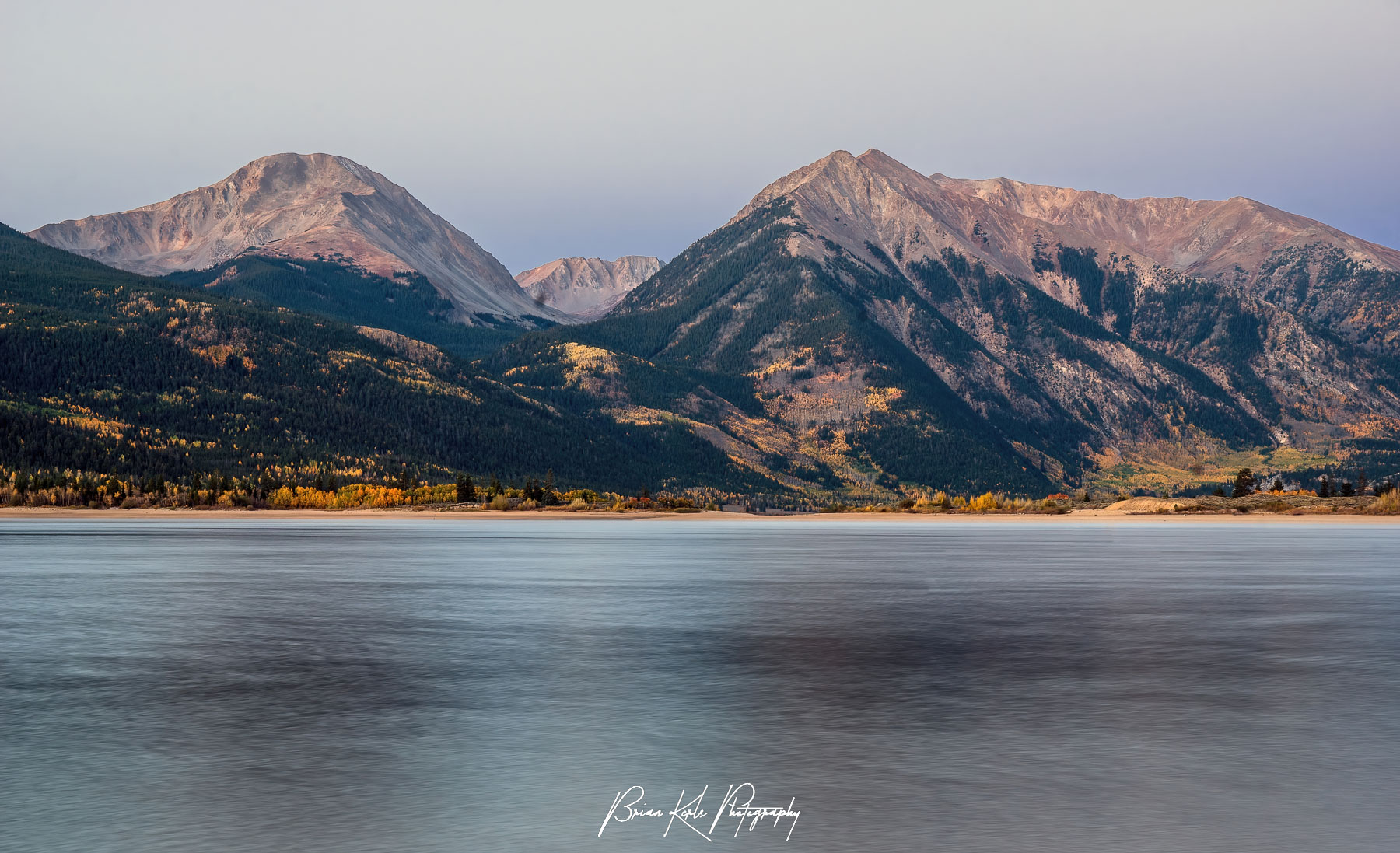 Mt. Hope and Rinker Peak rising above Twin Lakes, Colorado in the pre-dawn light on a cool autumn morning.