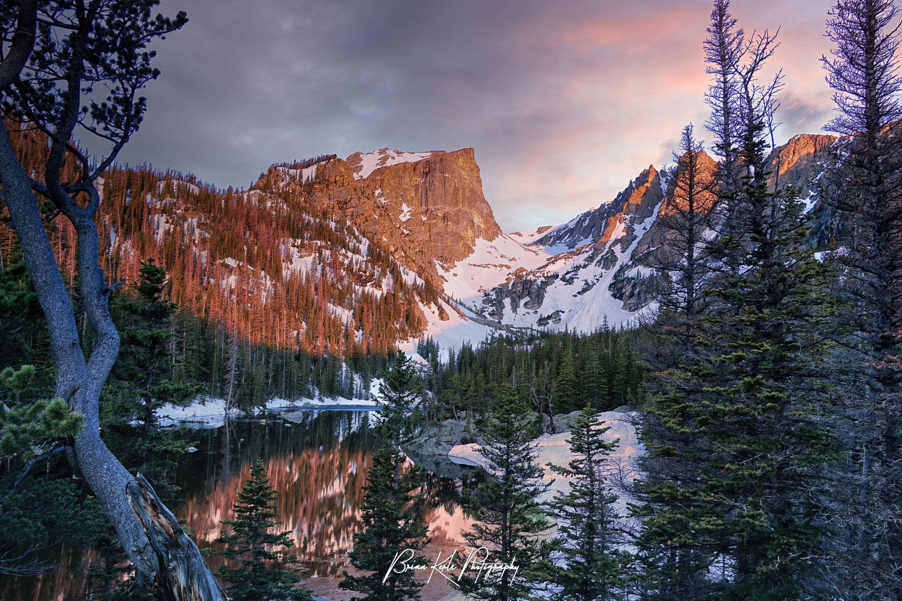 A colorful and moody sunrise at Dream Lake in Rocky Mountain National Park, Colorado.