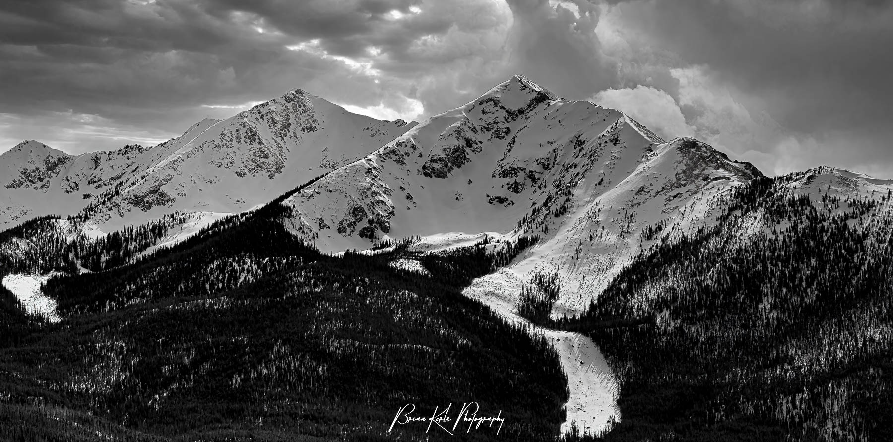 Clouds rolling in over Peak One and Ten Mile Peak on a winter afternoon. At just under 13,000', both peaks lie in the Ten Mile Range, rising above the town of Frisco, Colorado.