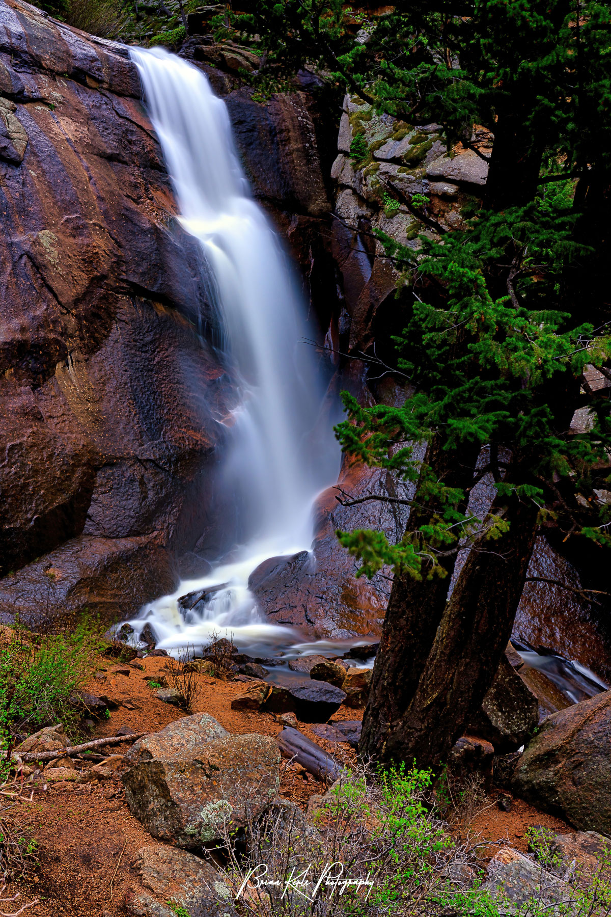 Nestled deep in a canyon in Staunton State Park, Colorado Elk Creek falls pours over a high granite cliff, dropping 75' into North Elk Creek. A 15 second exposure and a 10 stop ND1000 neutral density filter created the silky smooth effect for the waterfall.