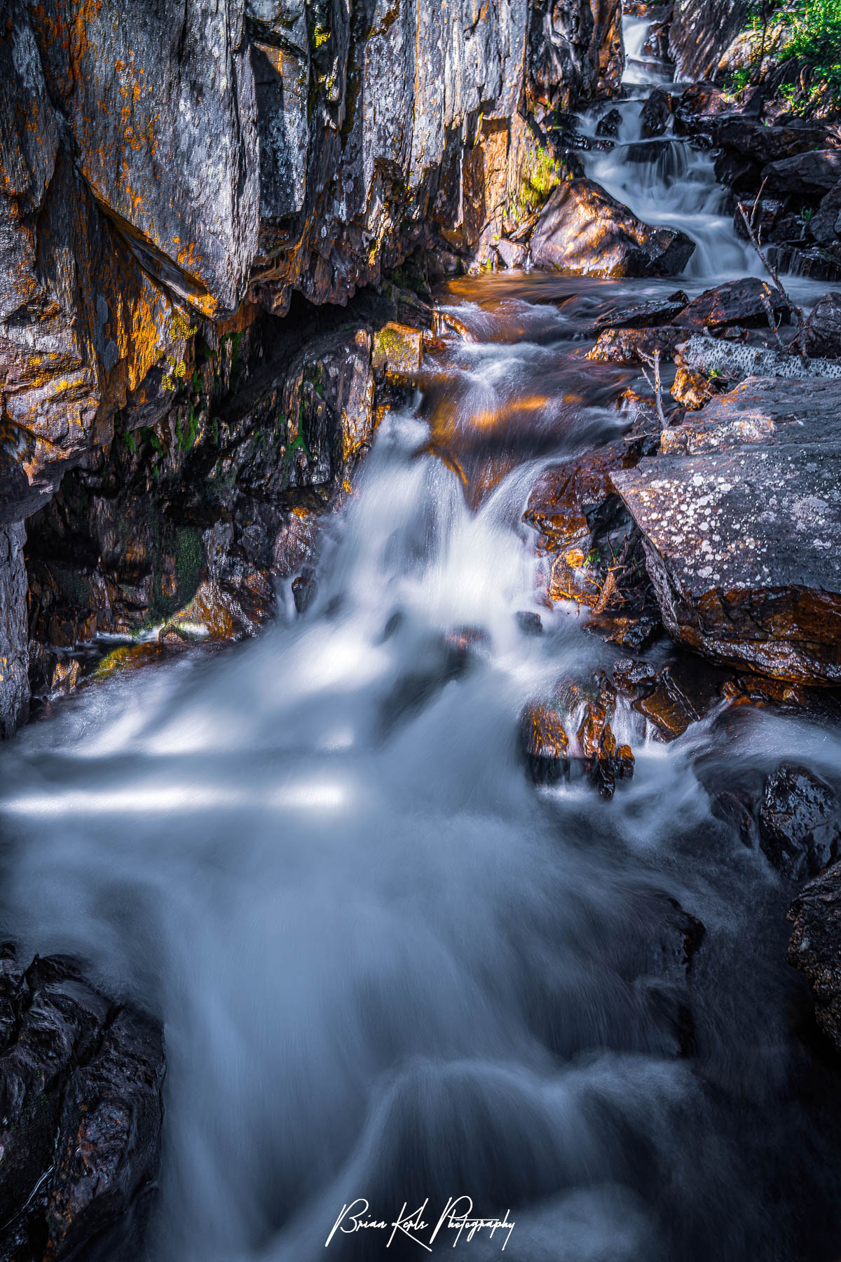 Missouri Creek cascades down a series of small wateralls in a steep gorge within the Holy Cross Wilderness Area of Colorado.