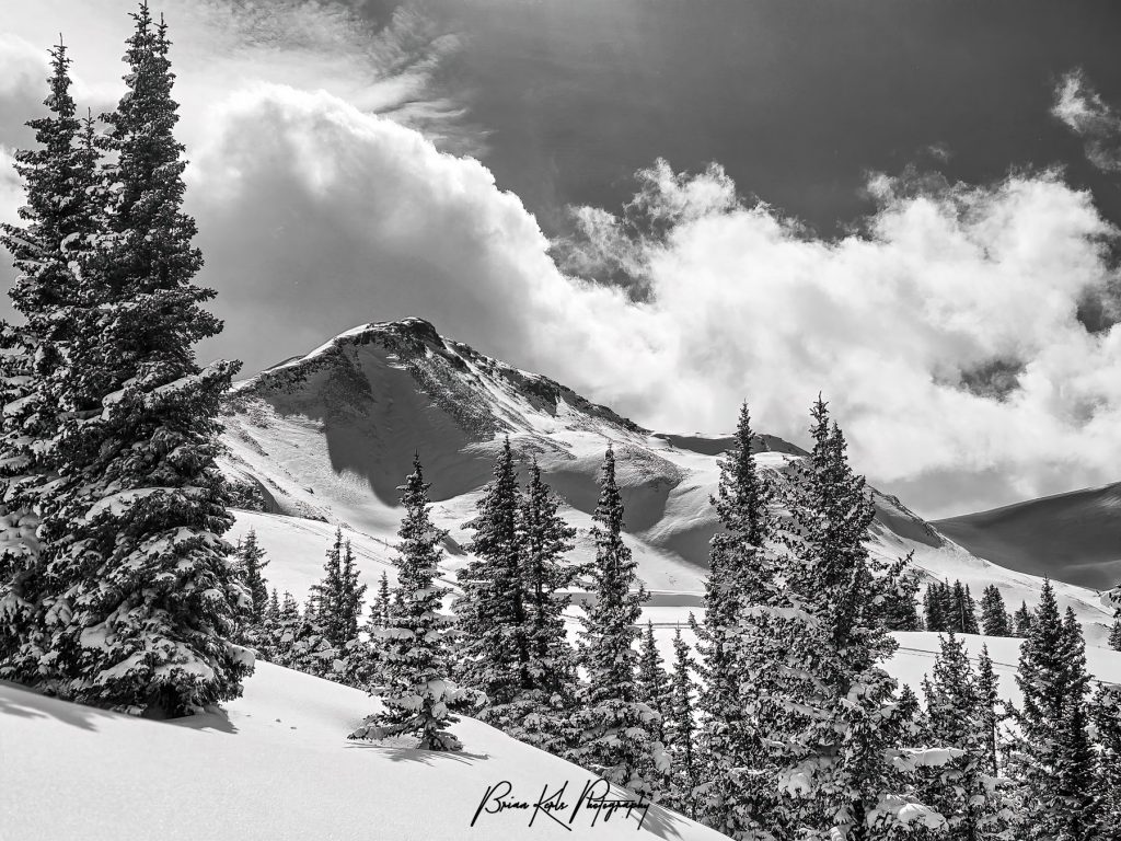 Jacque Peak in Copper Mountain, Colorado with a blanket of fresh snow and surrounded by billowing clouds. There’s just something about winter that strips away distractions and feels timeless. The snow-covered landscape – silent, still, and pure- becomes a canvas of contrasts - ideal for a black and white composition! The winter alpine landscape seems to come alive in black and white and convey that cold crisp feeling of being there in person in a way that color simply can’t convey.