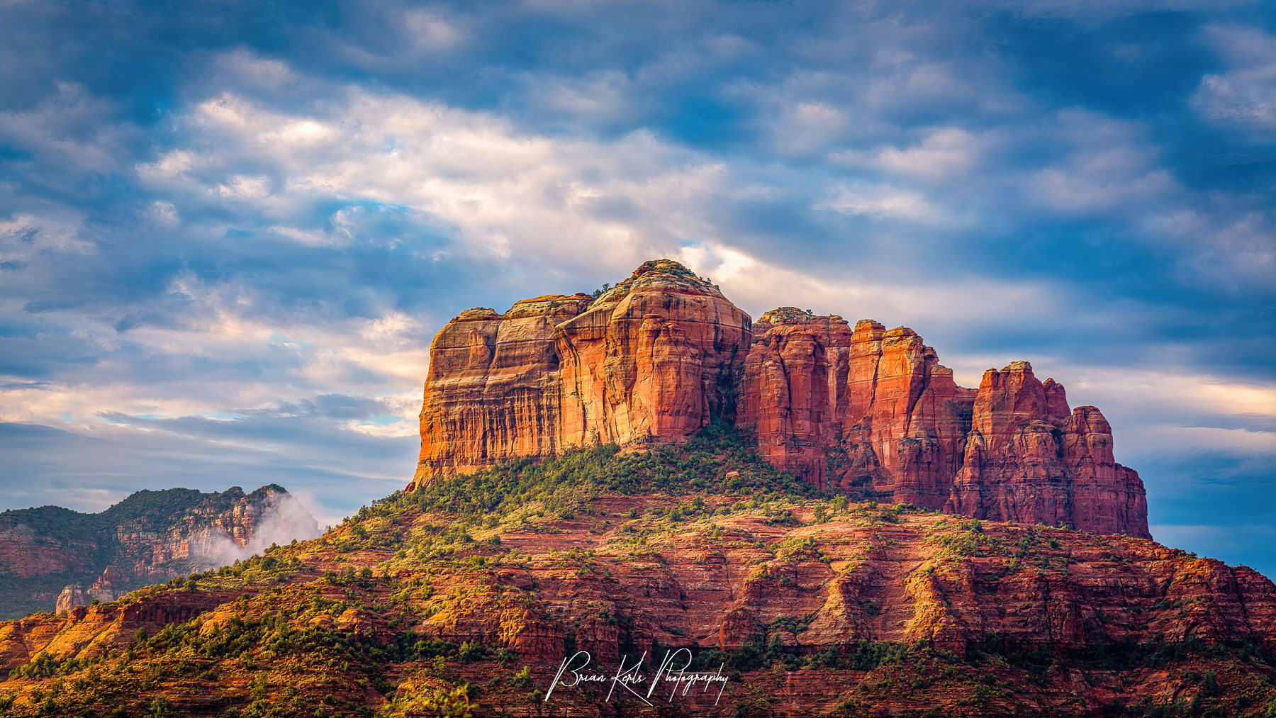 Fine art print of Cathedral Rock at sunrise in Sedona, Arizona — vibrant red rock formations glowing in golden morning light, perfect for home or office wall decor.