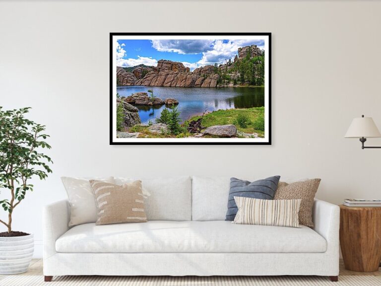 Framed photo of Sylvan Lake, South Dakota by Brian Kerls Photography over a sofa.